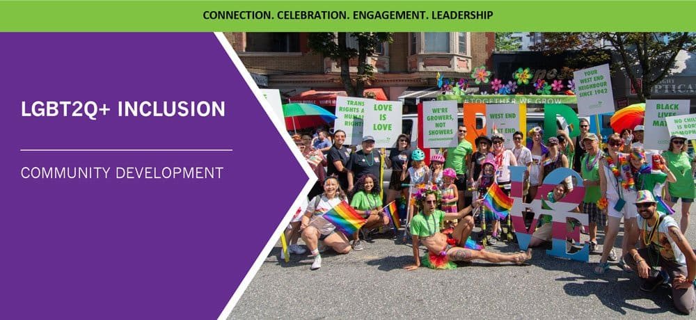 A photo showing people dressed in colourful outfits, in front of large letters spelling PRIDE, in downtown Vancouver at the 2018 parade